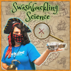 An educator wearing a pirate costume is holding an aluminum foil boat